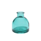 Chive Loft round glass bud vase in teal with a domed silhouette and short neck