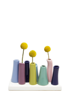 Chive Pooley ceramic bud vase set in Serenity pairs navy, mauve, and sage tubes on a connected tray.