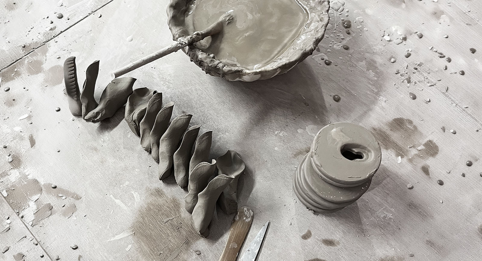 Chive artisan shaping a ceramic flower by hand — designed in Toronto by Chive Studio