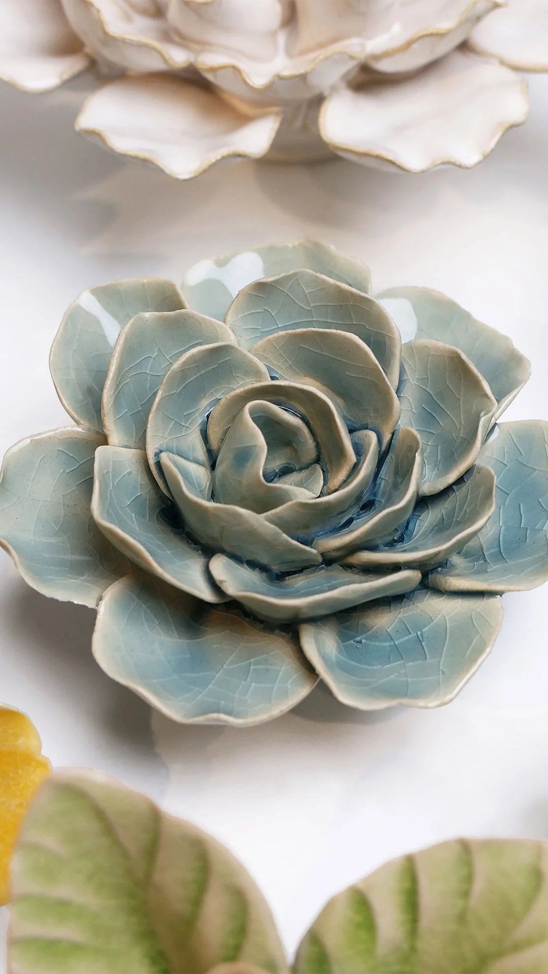 Powder Blue Amandine Ranunculus  ceramic wall flower styled on a white table with other flowers — Chive Studio