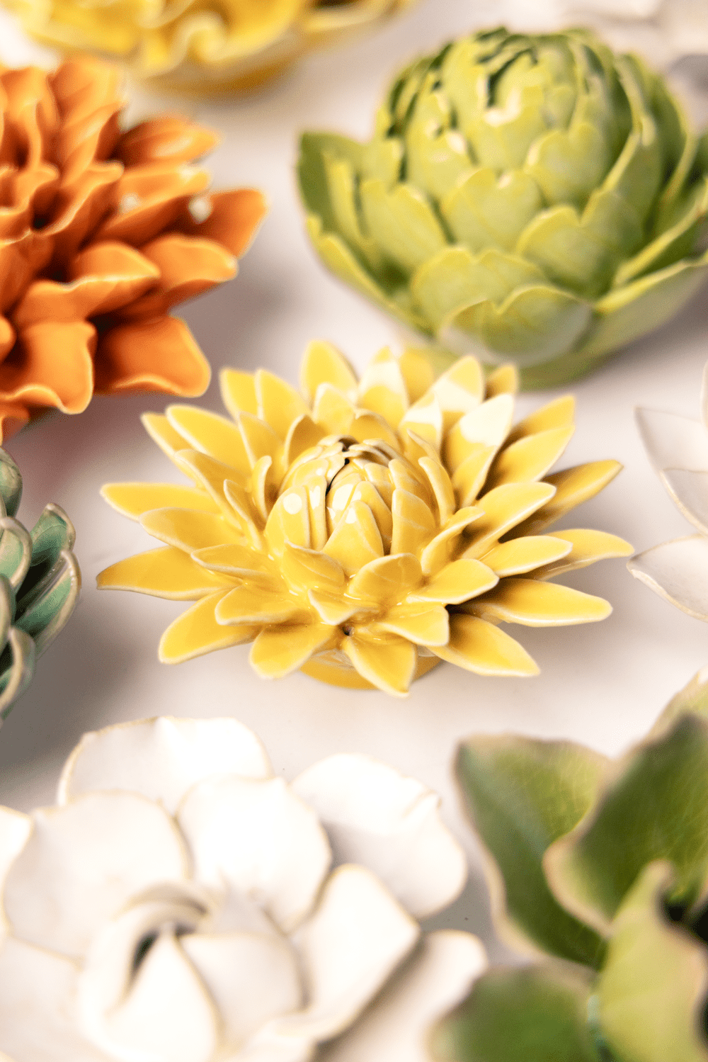 Burnt Yellow Strawflower ceramic wall flower styled on wall — English Garden — Chive Studio Toronto
