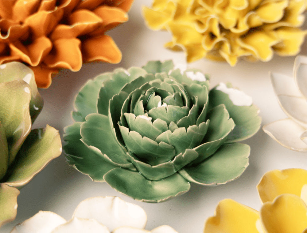Jade Green English Rose ceramic wall flowers in assorted colours styled on a light background — Chive Studio