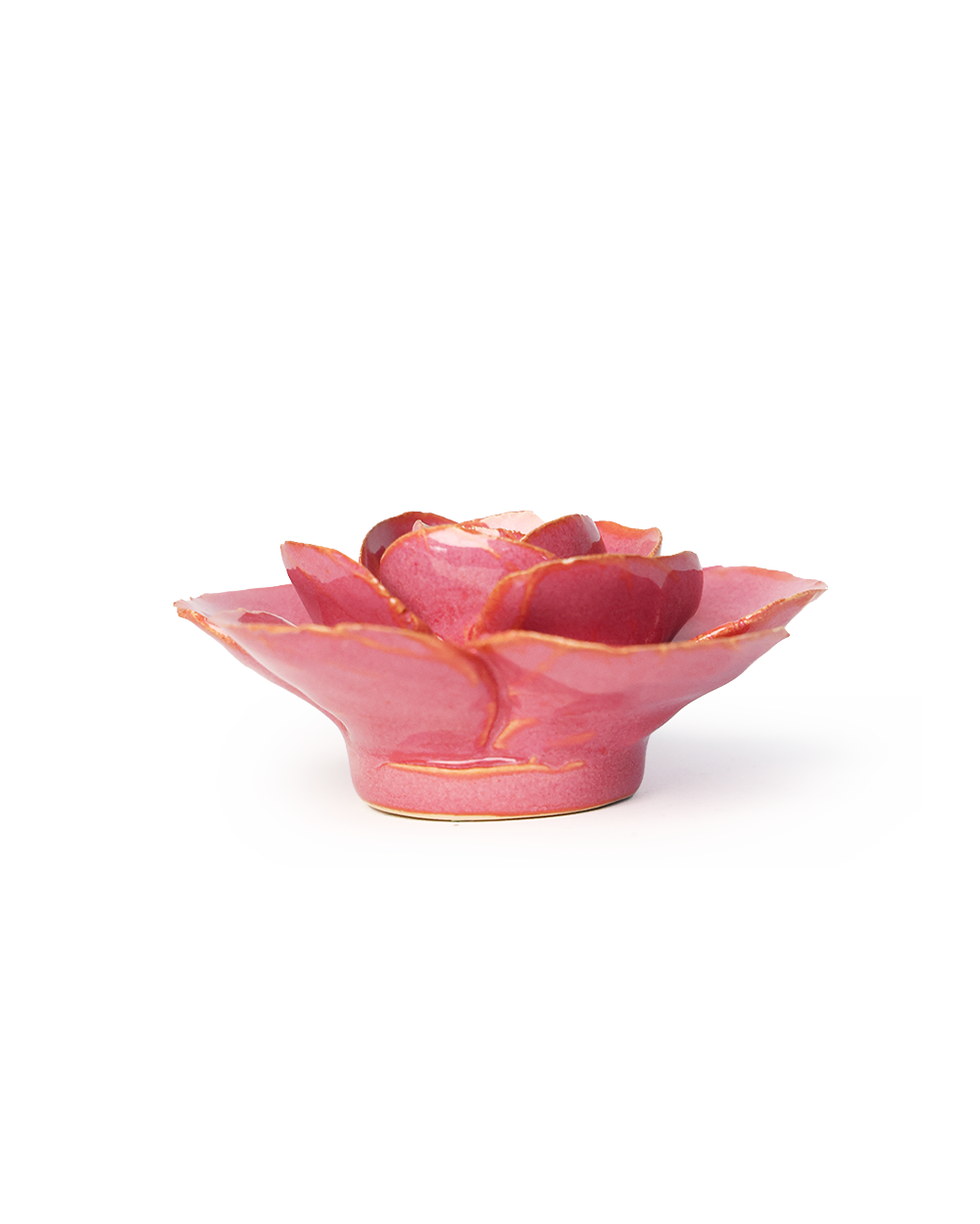 A small pink ceramic flower-shaped dish with gold-painted edges, photographed on a clean white background.