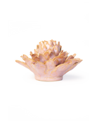 A small sculptural lotus flower vase or candle holder with layered petals, finished in a soft blush pink with metallic gold edging, photographed on a clean white background.