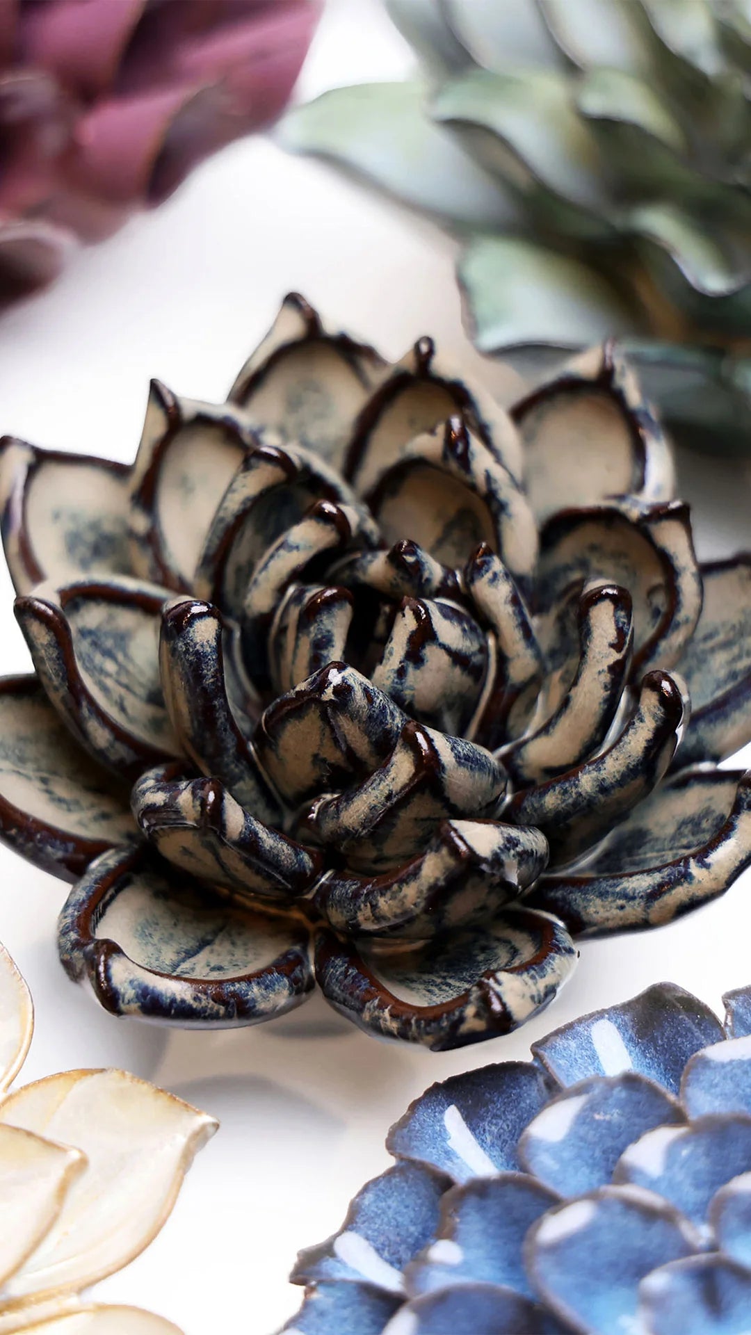 Latte Echeveria ceramic wall flower styled on a white table with other flowers — Chive Studio