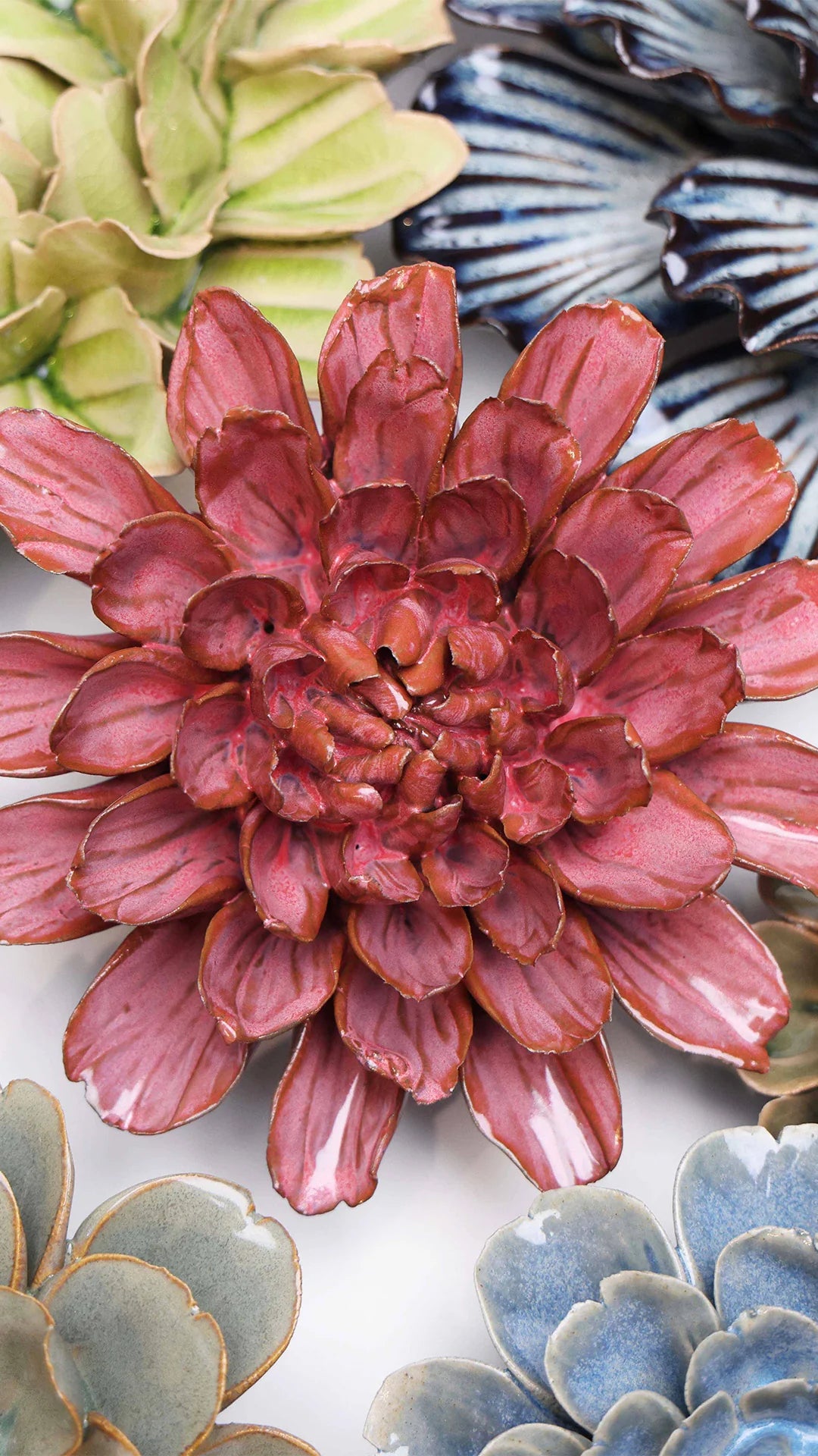 Blush Pink Star Dahlia ceramic wall flower styled on a white table with other flowers — Chive Studio