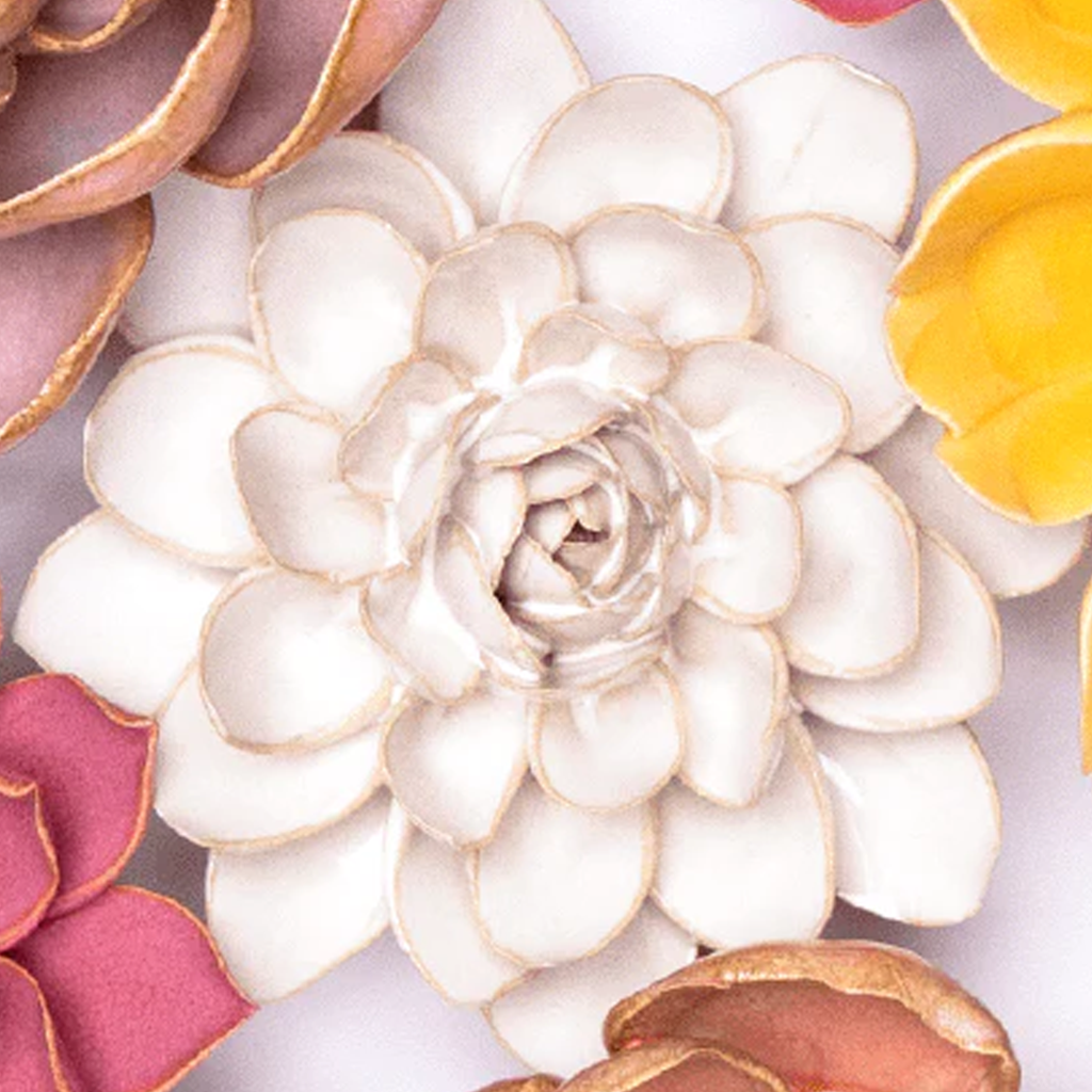 Chive handmade ceramic snowdrop wall flower hanging on a white wall, ivory petals, keyhole mount