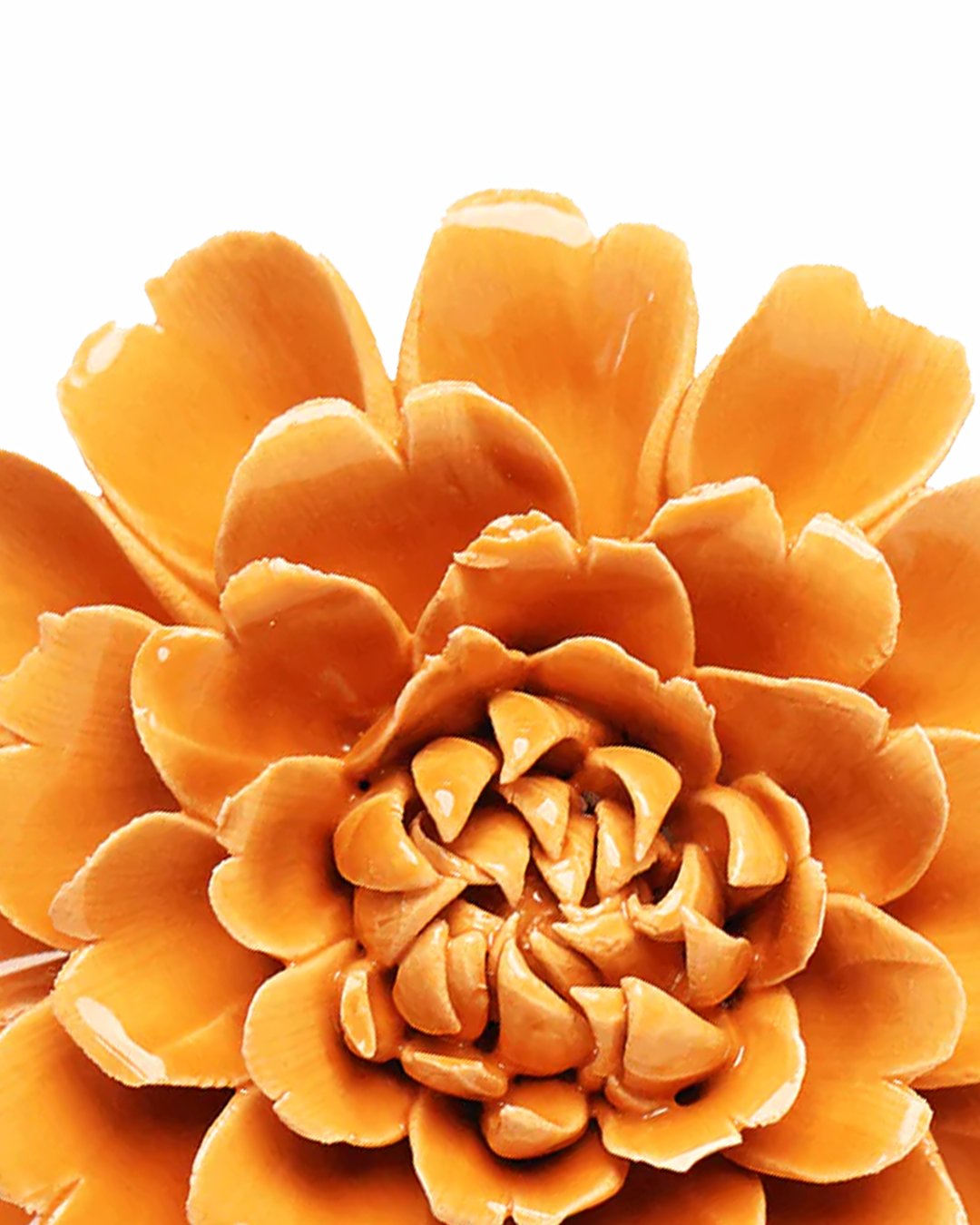Close-up detail of handmade ceramic orange fiesta marigold flower petals individually shaped by artisan, Chive ceramics Toronto, no molds used