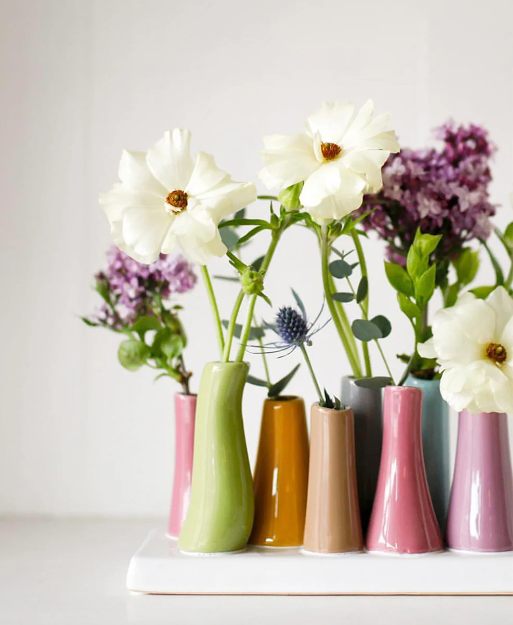 Pooley Magenta 8 Tube Ceramic Flower Vase - Close up of styled decorative vases with an arrangement of flowers for a table or desk setting