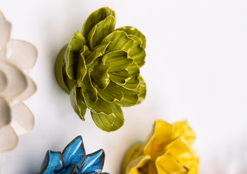Chive ceramic birth flowers January snowdrop, March daffodil and February primrose combined on white wall, cool-toned palette, handmade ceramic wall art