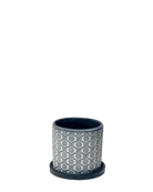 Chive Balter ceramic planter in black flower with an embossed floral tile pattern and matching saucer.