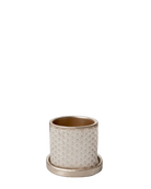 Chive Balter ceramic planter in gold with an embossed star geometric pattern and matching saucer.