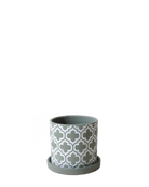 Chive Balter ceramic planter in olive with an embossed white quatrefoil pattern and matching saucer.