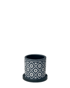 Chive Balter ceramic planter in dark navy with an embossed white floral tile pattern and saucer.
