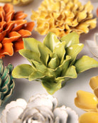 Close-up of the Chive July Birth Flower Water Lily chartreuse ceramic flower among assorted Chive ceramic flowers.