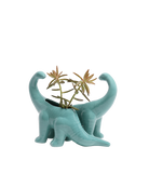 Two Chive Brontosaurus Cascade teal color glazed ceramic dinosaur shaped planters styled with a plant.