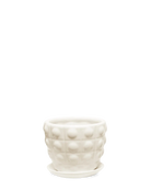 Chive Convex white fully glazed bubble-textured ceramic medium planter with saucer.