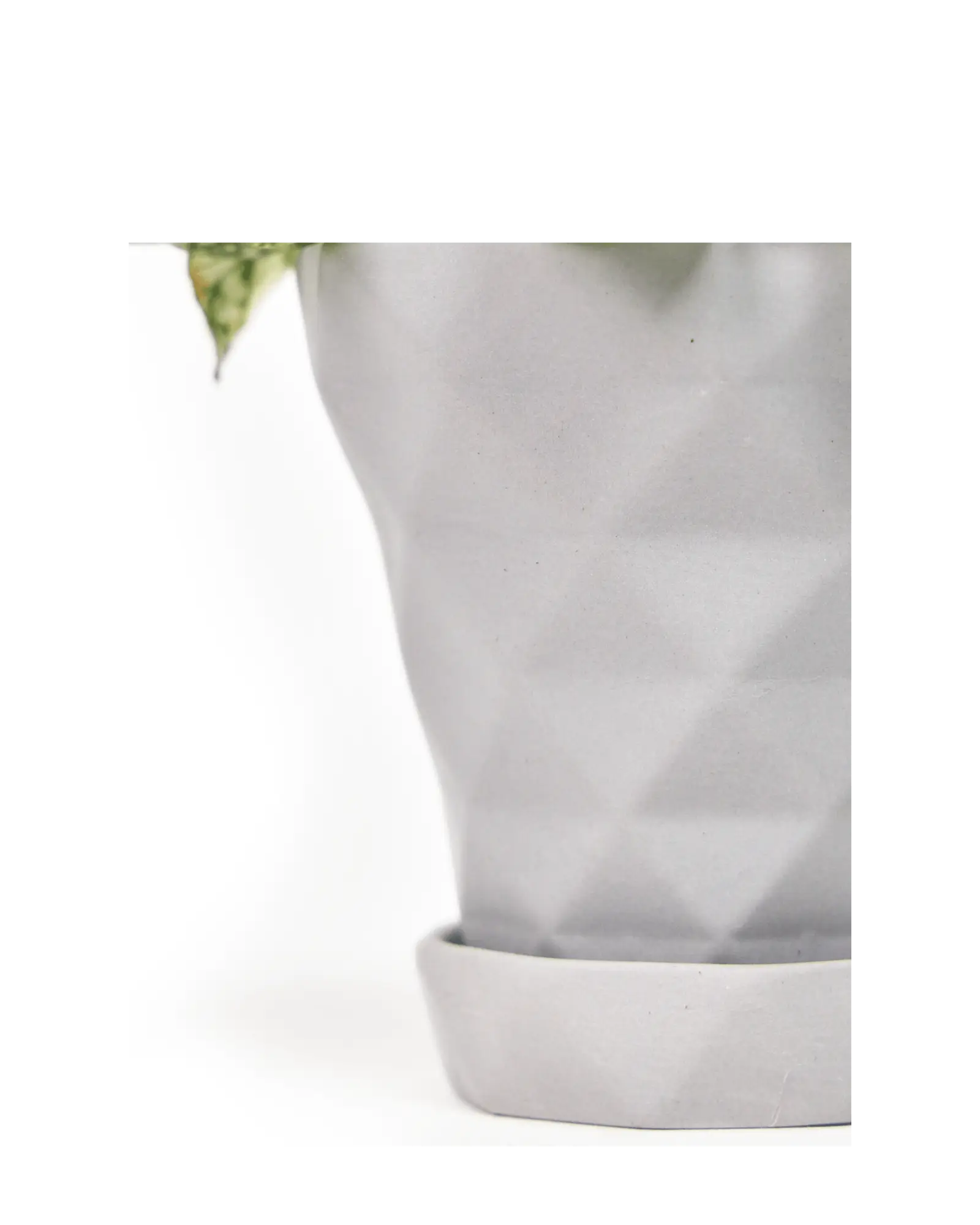 Close up of Chive Diamond small light grey porcelain plant pot with drainage hole and detachable saucer.