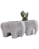 Two Chive Elephant Grey color glazed ceramic elephant shaped planters styled with a cactus.