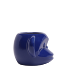 Side view of Chive Funky Monkey Blue color ceramic monkey shaped succulent planter with no drainage.