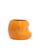 Side view of Chive Funky Monkey Orange ceramic monkey shaped succulent planter with no drainage.
