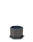 Chive Hexi black matte ceramic medium hexagonal planter with matching saucer.