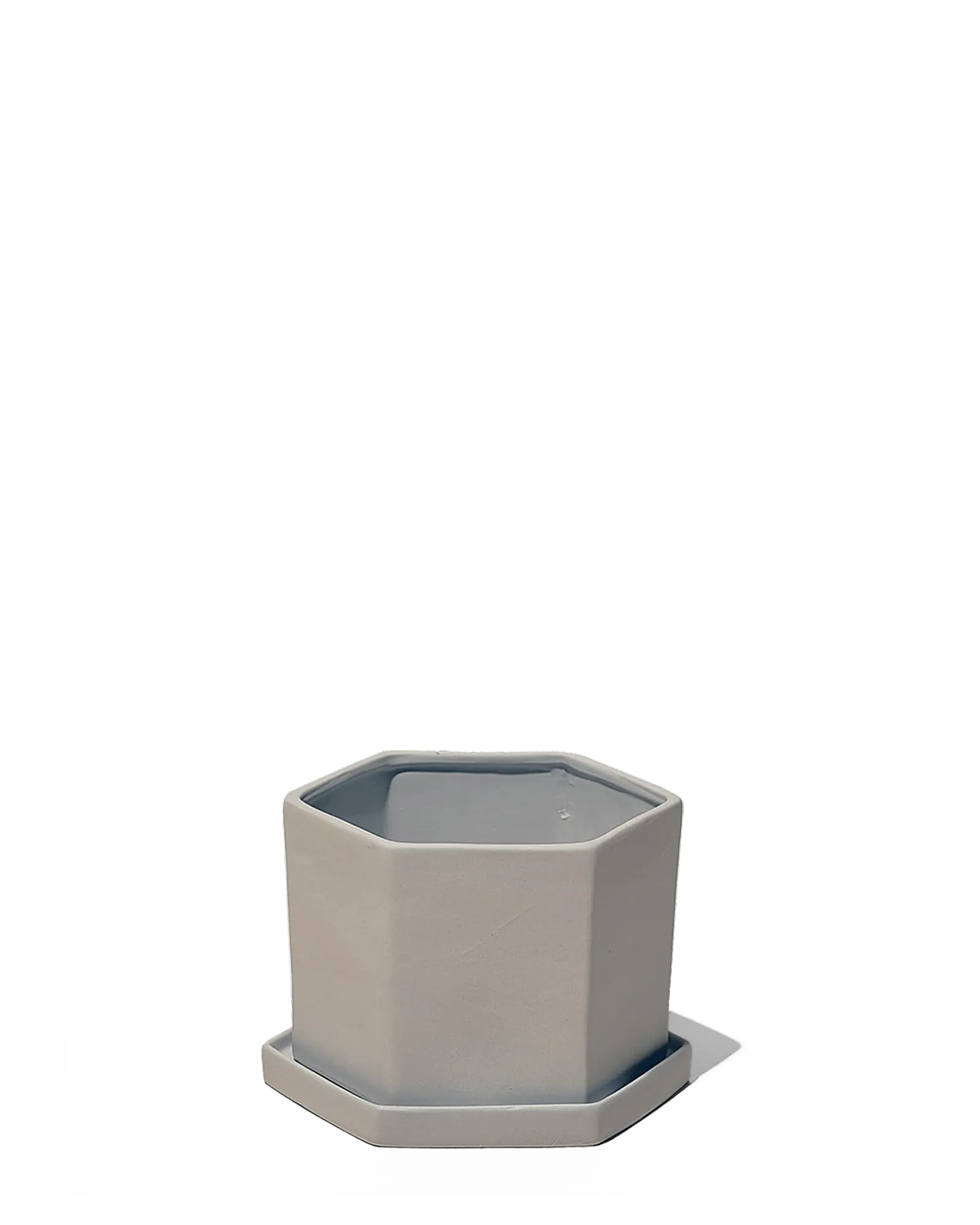 Chive Hexi light grey matte ceramic medium hexagonal planter with matching saucer.