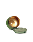 Close up of Chive Joe small green gold color metal plant pot drainage hole and detachable saucer.