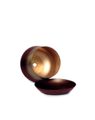 Close up of Chive Joe small mahogany gold color metal plant pot drainage hole and detachable saucer.