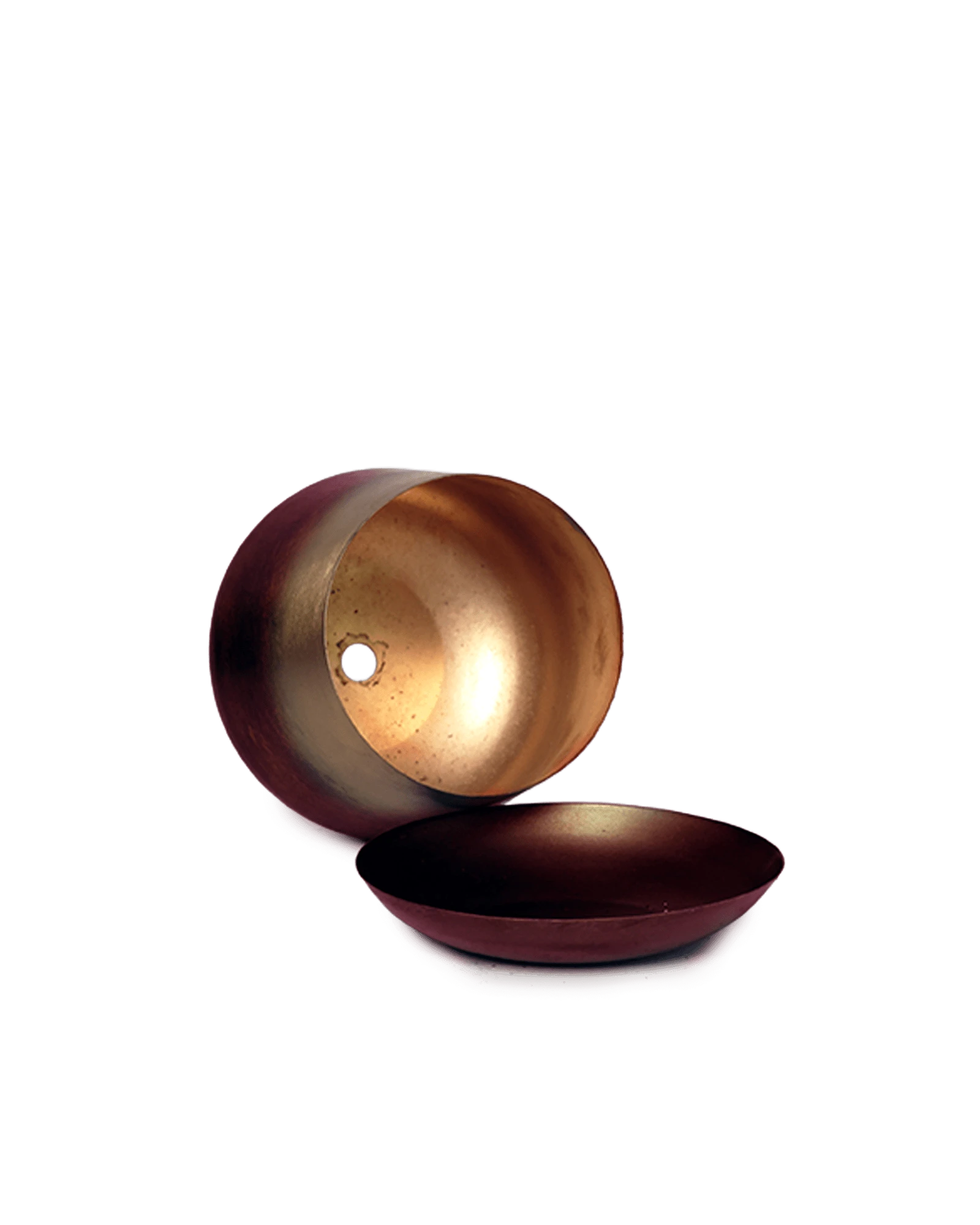 Close up of Chive Joe small mahogany gold color metal plant pot drainage hole and detachable saucer.