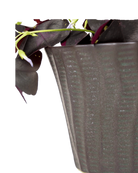 Close-up of the vertical ribbed texture finish on a Chive Katakana black ceramic pot.