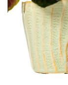 Close-up of the vertical ribbed texture on a Chive Katakana green ceramic pot.