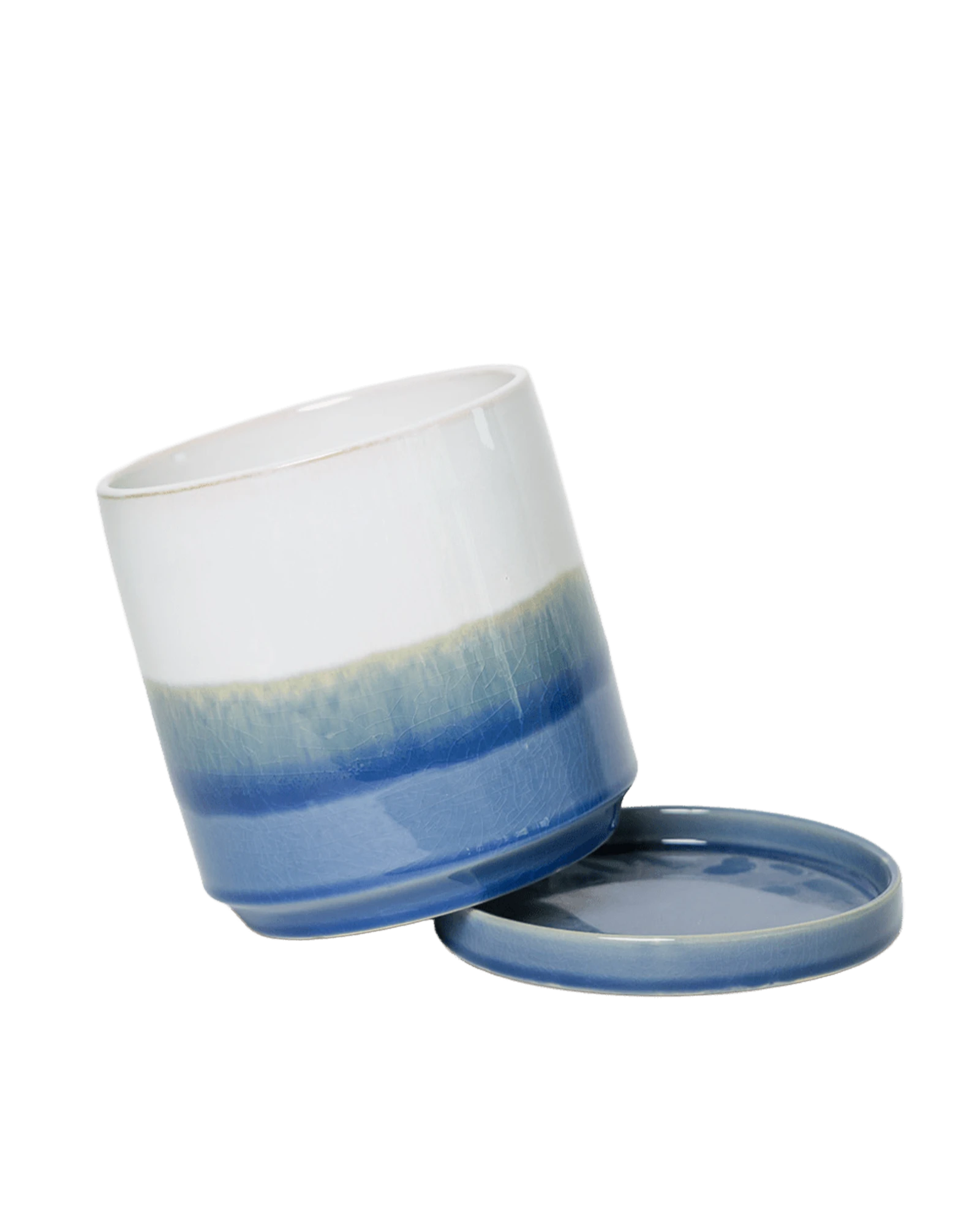 Close-up of the detachable saucer and drainage on a Chive Minute small blue layers ceramic pot.