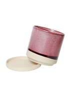 Chive Minute medium burgundy ceramic pot with drainage tilted to show the detachable saucer.