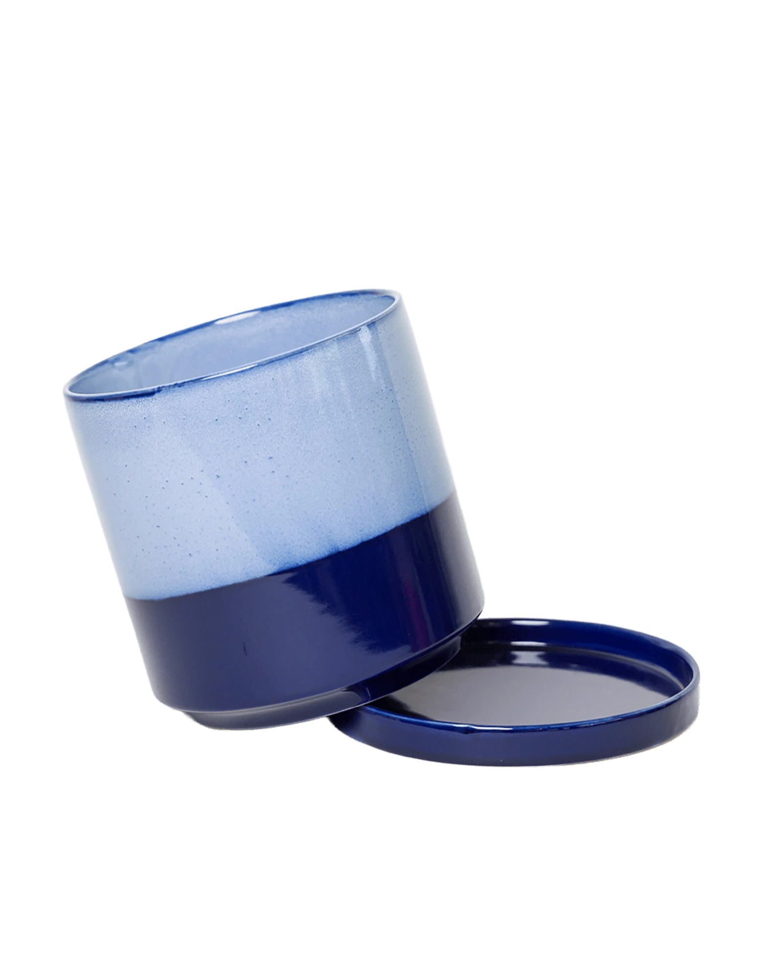 Close-up of the detachable saucer and drainage on a Chive Minute small cobalt blue ceramic pot.