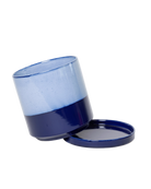 Close-up of the detachable saucer and drainage on a Chive Minute small cobalt blue ceramic pot.