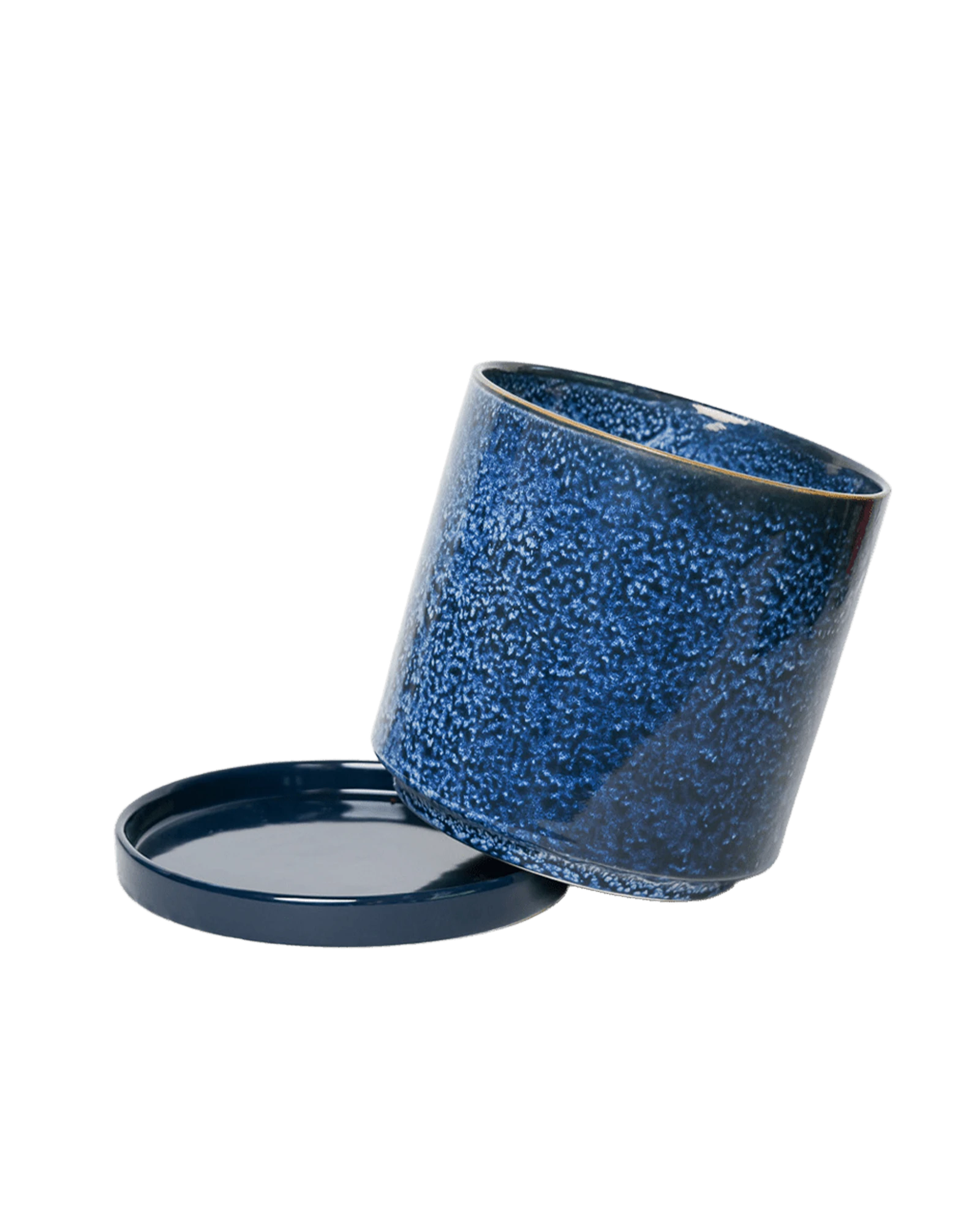 Close-up of the detachable saucer and drainage hole on a Chive Minute small cosmos ceramic pot.