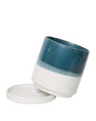 Chive Minute small green-blue ceramic pot with drainage tilted to show the detachable saucer.