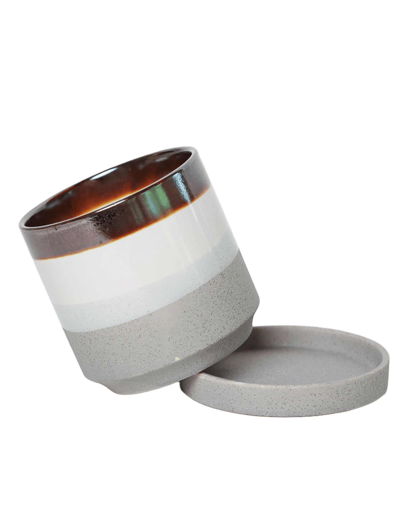 Chive Minute small mocha cement ceramic pot with drainage tilted to show the detachable saucer.