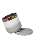 Chive Minute small mocha cement ceramic pot with drainage tilted to show the detachable saucer.