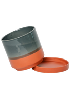 Chive Minute medium terracotta ceramic pot with drainage tilted to show the detachable saucer.