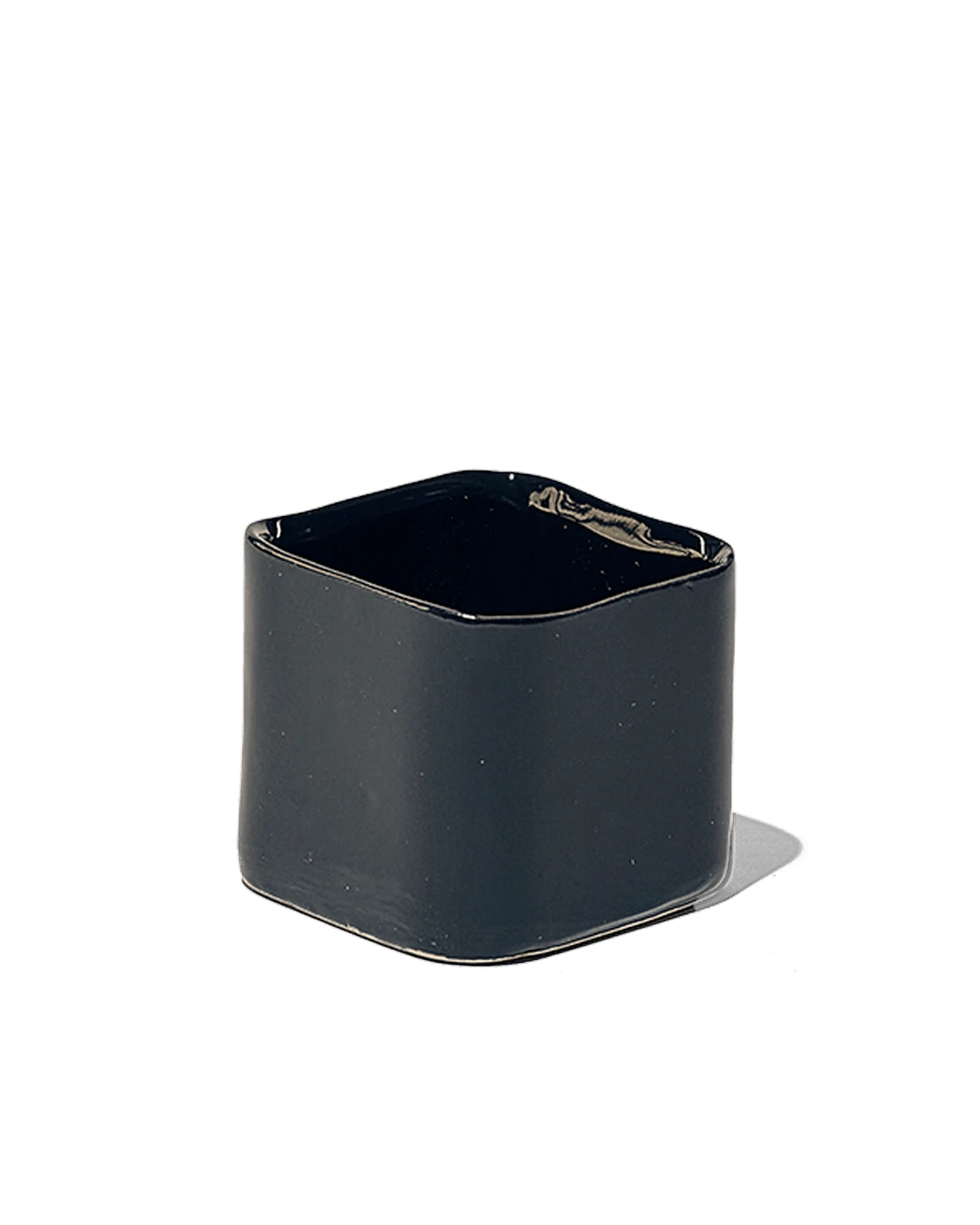 Chive Svek black fully glazed ceramic planter with no drainage.