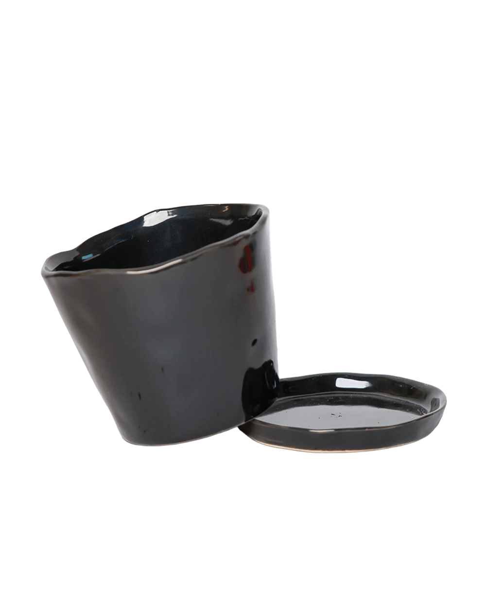 Chive Tika black ceramic large plant pot with drainage tilted to show the detachable saucer.