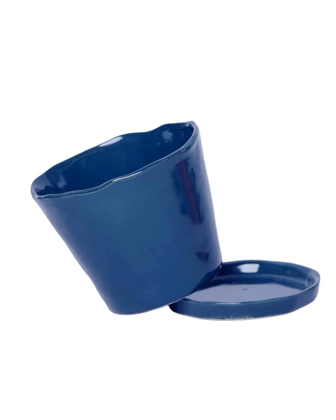 Close-up of the detachable saucer and drainage hole on a Chive Tika cobalt ceramic pot.