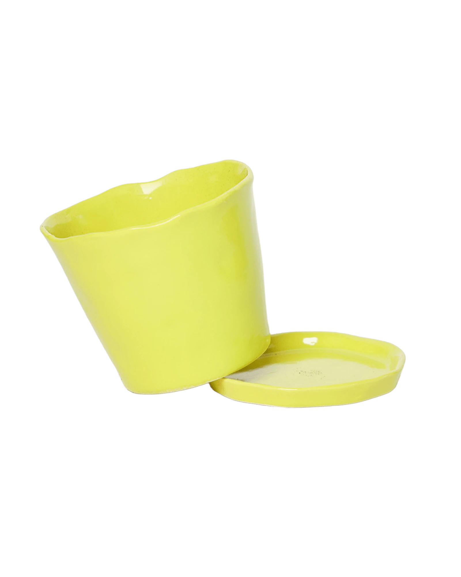 Chive Tika green sheen ceramic small plant pot with drainage tilted to show the detachable saucer.