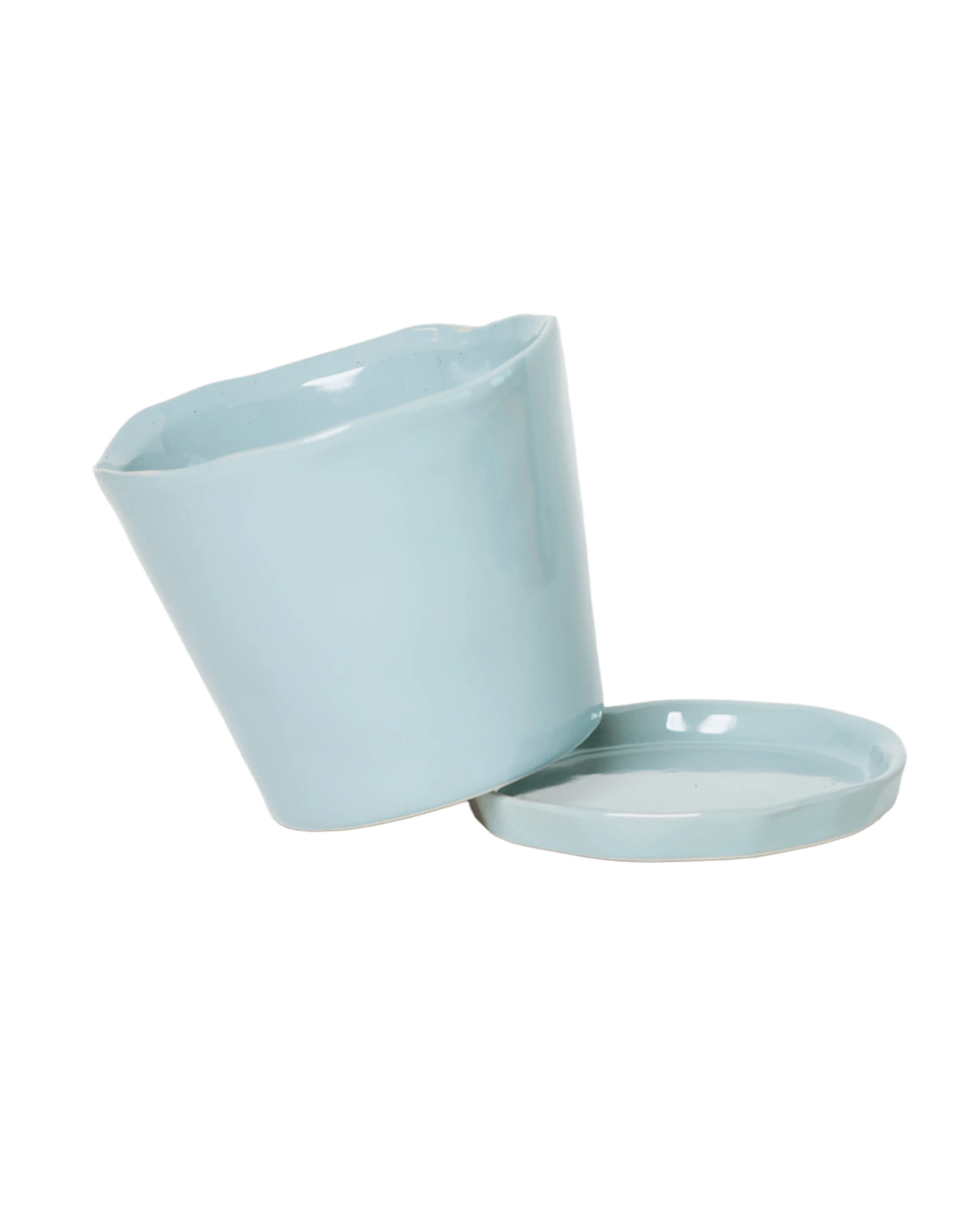 Close-up of the detachable saucer and drainage hole on a Chive Tika new grey ceramic medium pot.
