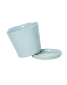 Close-up of the detachable saucer and drainage hole on a Chive Tika new grey ceramic medium pot.