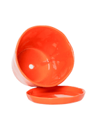 Close-up of the detachable saucer and drainage hole on a Chive Tika orange ceramic large pot.