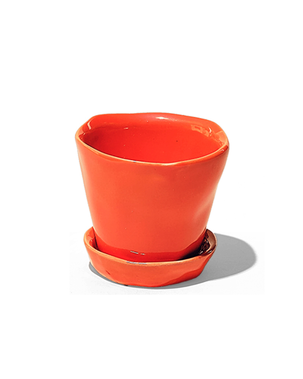 Chive Tika orange ceramic small plant pot with drainage hole and detachable saucer.