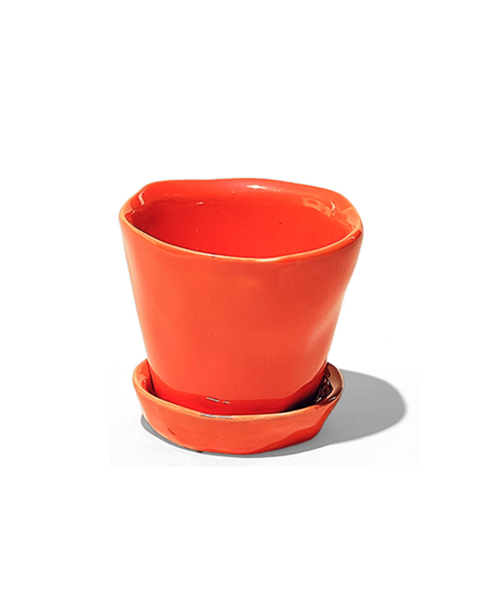 Chive Tika orange ceramic small plant pot with drainage hole and detachable saucer.